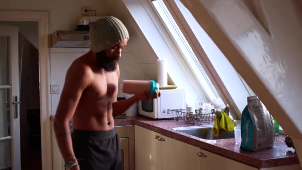young male making whey shake at home for breakfast - Séquence, vidéo