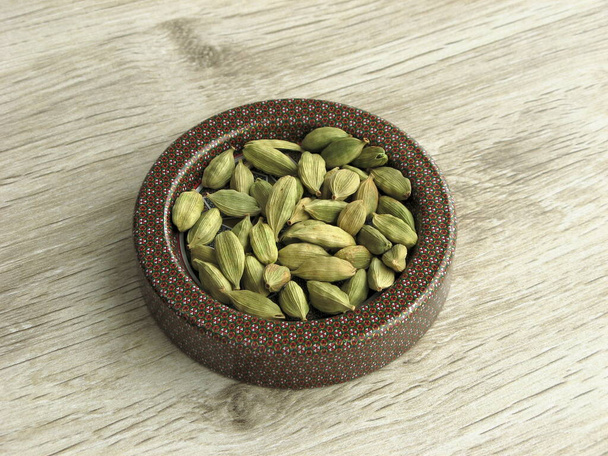 Dry Cardamom Seeds. Light green processed pods of Elettaria cardamomum, dried seeds, used as flavorings, spice and as medicine. - Photo, Image