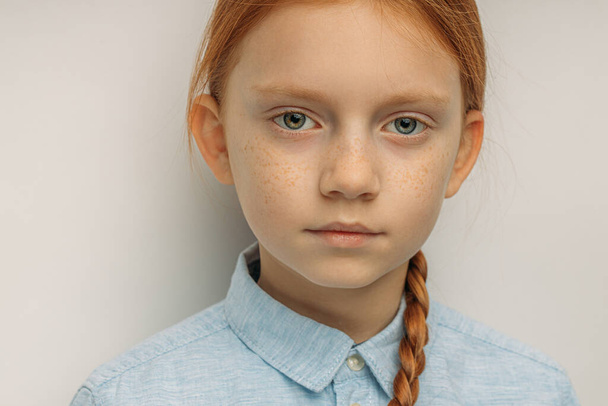 close-up portrait of serious red haired girl isolated - Foto, Imagen