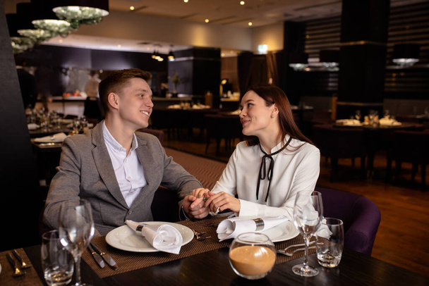 beautiful couple have dinner in rich restaurant - Fotó, kép