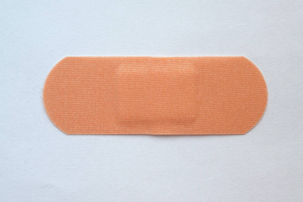 A large medical bactericidal woven patch on a white background. elastic patch top view. - Photo, Image