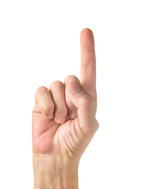 Menschliche Hand mit erhobenem Zeigefinger über weißem Hintergrund - Foto, Bild