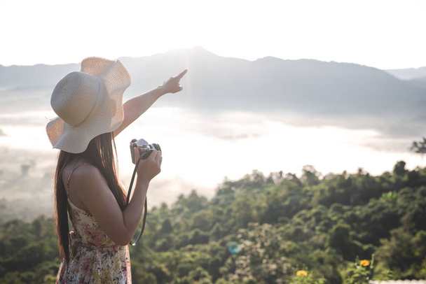 Happy woman pointing on the viewpoint - Foto, imagen
