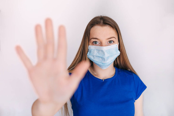 Coronavirus and Air pollution pm2.5 concept. girl wearing mask for protect pm2.5 and show stop hands gesture for stop corona virus outbreak. Wuhan coronavirus and epidemic virus symptoms. - 写真・画像