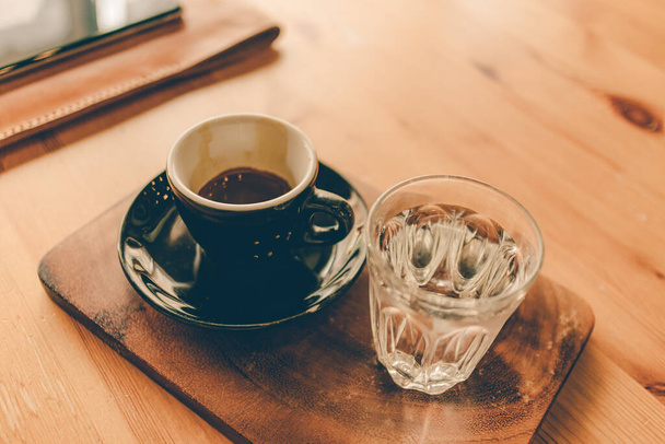Set of espresso coffee cup with a glass of water. - Foto, imagen