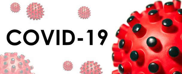 Beschriftung COVID-19 auf weißem Hintergrund. Weltgesundheitsorganisation WHO führt neuen offiziellen Namen für Coronavirus ein  - Foto, Bild