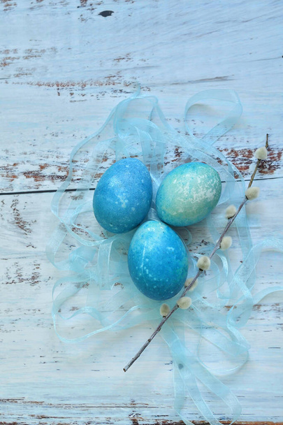 Blue Easter eggs on light background. Naturally Eggs painted with hibiscus and red cabbage with marble stone effect.Eco paint. Happy Easter card. Selective focus.top view, - Photo, Image
