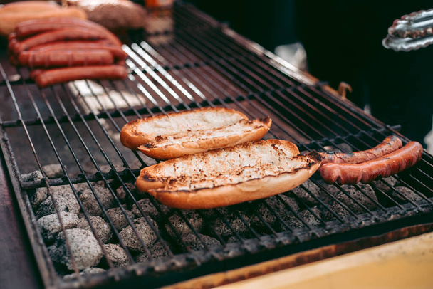 Delicious fresh hot dogs on the grill - Photo, Image