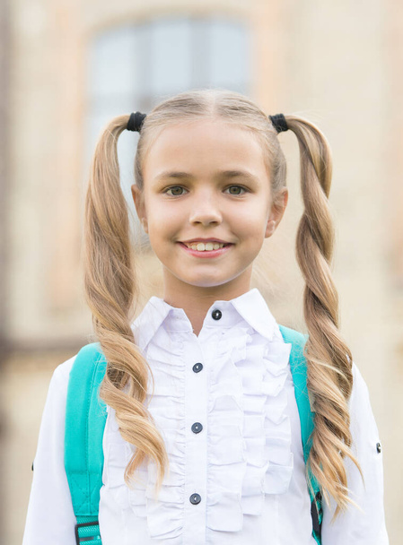 Forever gorgeous. Happy child back to school. Little child with cute smile outdoors. Small child wear long wavy hair. Beauty salon. Fashion and style. Child care and childhood. School and study - Fotografie, Obrázek