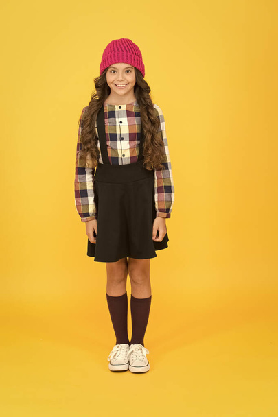Hipster girl. Kids clothes. School fashion. Feeling comfy. Girl wear fashionable outfit. Black dress. Formal clothes for visiting school. Daily outfit. Adorable schoolgirl. Perfect matching clothes - Valokuva, kuva