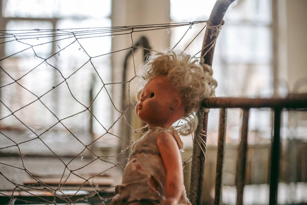 Soft toy doll in an abandoned school in Pripyat in Chernobyl - Fotoğraf, Görsel