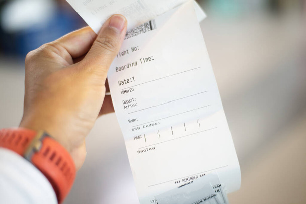 Blurred  Airline ticket in hand transportation concept. - Foto, afbeelding