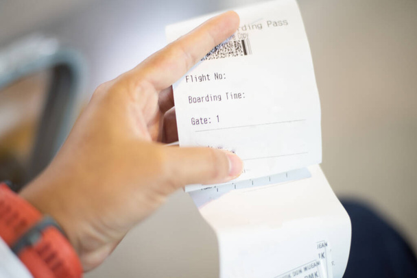Blurred  Airline ticket in hand transportation concept. - Foto, Imagem