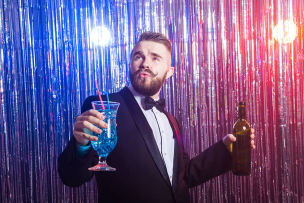 Alcoholism, fun and fool concept - Drunk man at party in a nightclub. - Zdjęcie, obraz