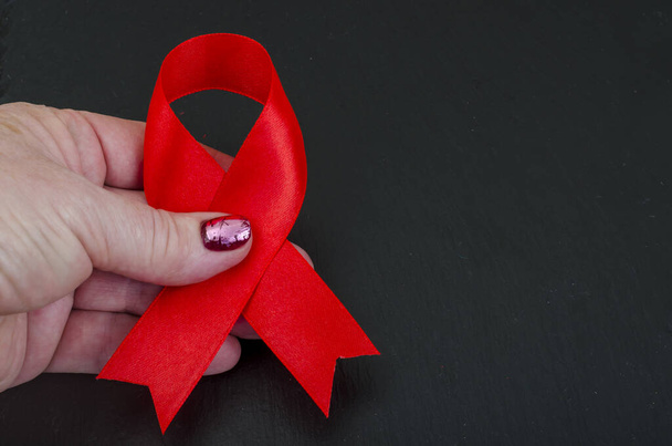 AIDS világnap, piros szalag, szimbólum. Stúdió Photo - Fotó, kép