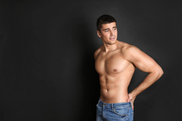 Man with sexy body on black background - Φωτογραφία, εικόνα