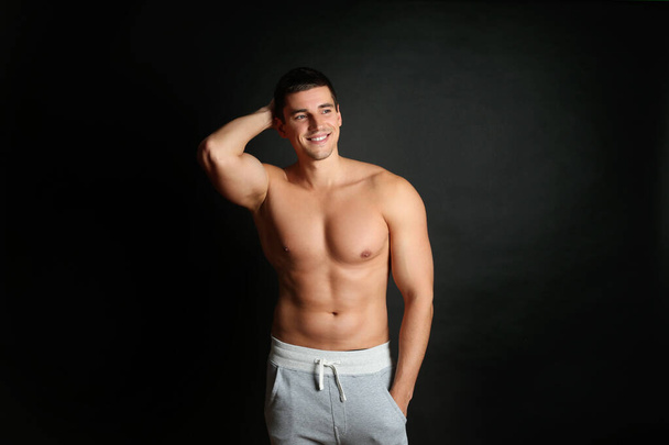 Man with sexy body on black background - Foto, immagini