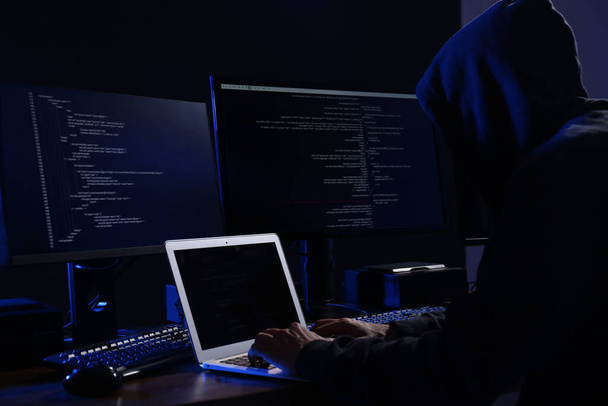 Hacker with computers in dark room. Cyber crime - Fotoğraf, Görsel