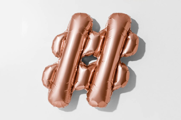Hashtag symbol or #, Rose gold foil balloon alphabet isolated on a white background with Clipping Path - Foto, immagini