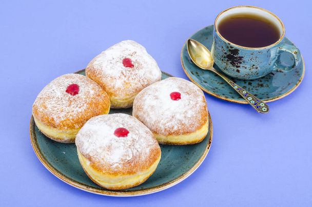 Traditional food doughnuts with icing sugar and jam. Concept and background Jewish holiday Hanukkah. Studio Photo - Photo, Image