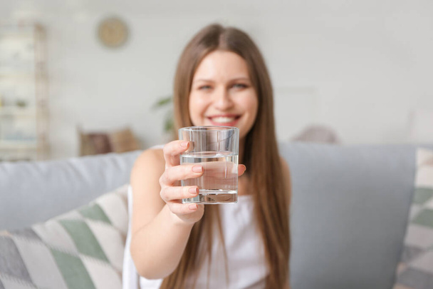 Beautiful young woman drinking water at home - Foto, Imagem
