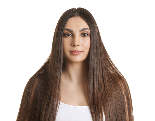 Young woman with beautiful straight hair on white background - Fotó, kép