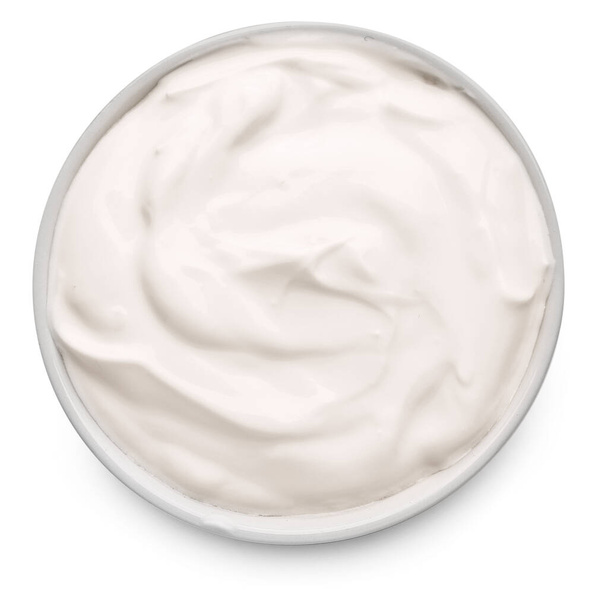 Cuenco con sabrosa crema agria sobre fondo blanco
 - Foto, Imagen