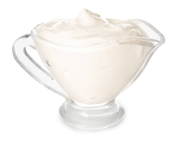 Gravy-boat with tasty sour cream on white background - Photo, Image
