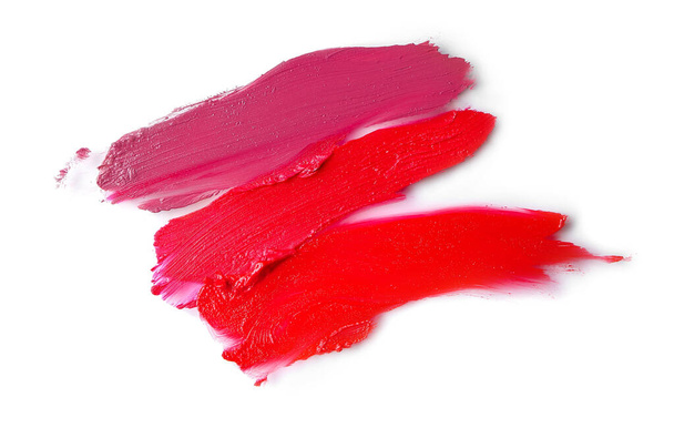 Coups de rouges à lèvres brillants sur fond blanc
 - Photo, image