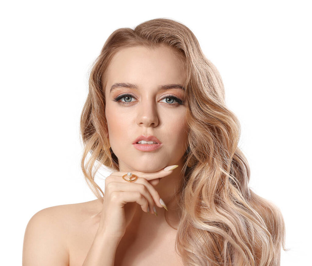 Young blonde with beautiful hair on white background - Photo, Image