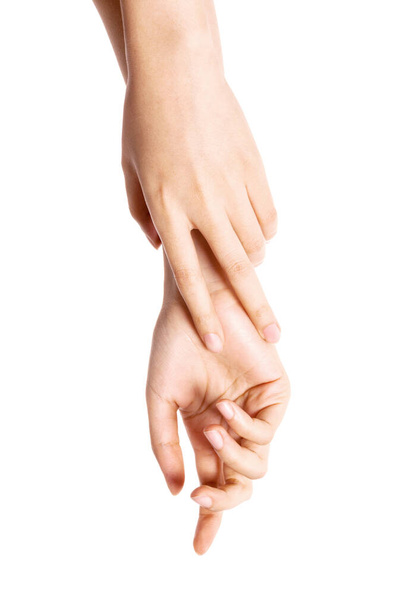 Mujer dos manos se tocan entre sí para cosméticos aislados en blanco
. - Foto, Imagen
