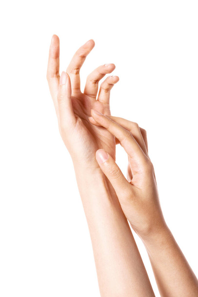Frau zwei Hände berühren einander für kosmetische isoliert auf weiß. - Foto, Bild
