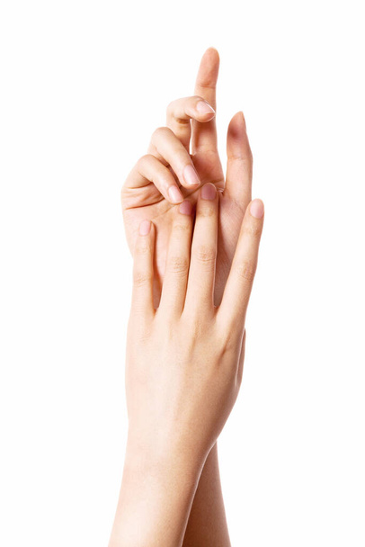 Γυναίκα δύο χέρια αγγίζουν το ένα το άλλο για καλλυντικά που απομονώνονται σε λευκό. - Φωτογραφία, εικόνα