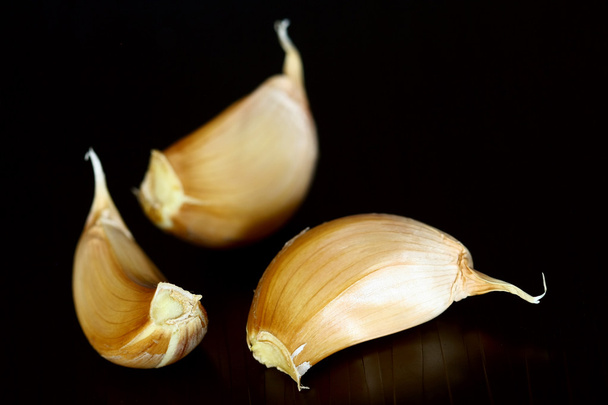 Garlic on black - Foto, Imagem
