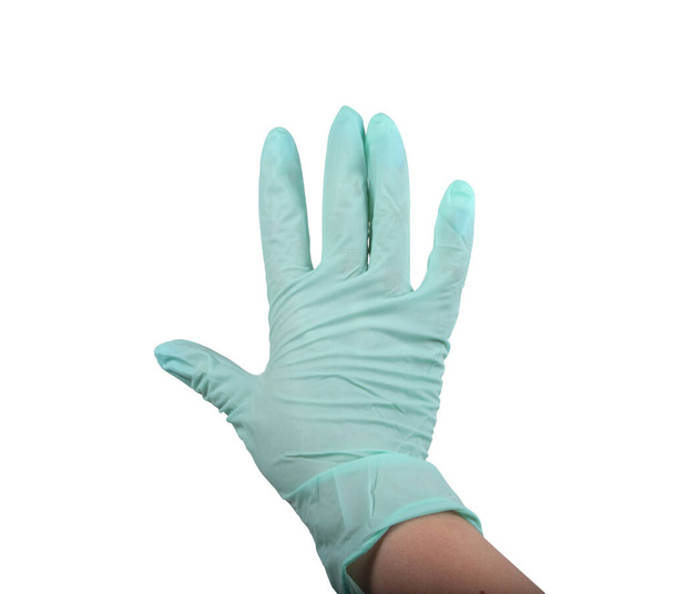 Green rubber glove on hand isolated on the white - Φωτογραφία, εικόνα