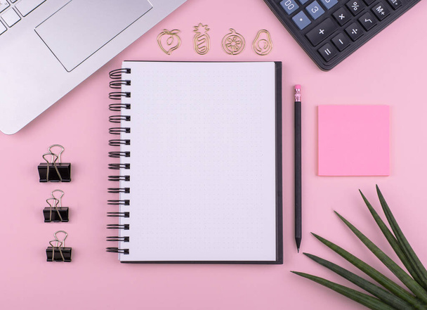 Home office, stationery, Notepad, computer, calculator flower on pink background, copy space - Fotó, kép