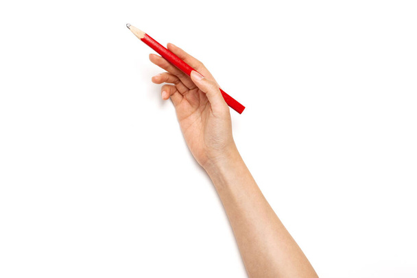 Nainen käsi pitää punainen kynä eristetty valkoinen
. - Valokuva, kuva