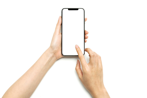 Kobieta ręka trzymać smartfon odizolowany na białym. - Zdjęcie, obraz