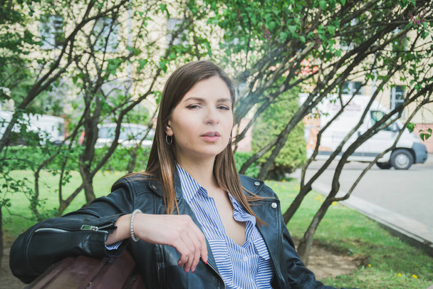 Young girl smoke cigarette at park, lifestyle concept - Fotografie, Obrázek