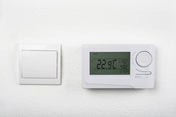 Modern heat thermostat on a white background - Photo, Image