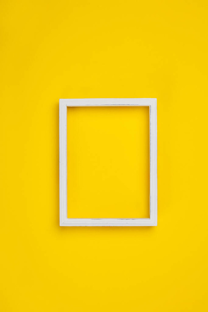 White vintage frame on yellow background, space for text - Fotografie, Obrázek