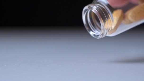 Hand Pours Out Bottle Of Pills On To Table In Slow Motion - Séquence, vidéo