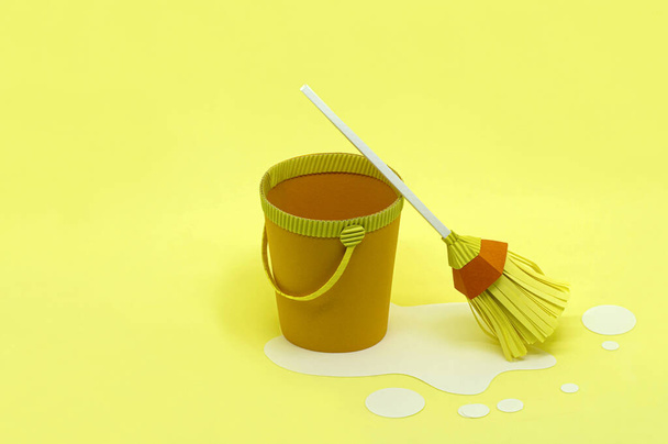 Paper bucket and mop for cleaning. Spring cleaning. Paper craft and art. Real volumetric handmade paper objects. Minimal art cleaning service concept. Copy space - Photo, Image