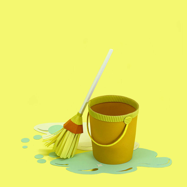 Paper bucket with spilled water and mop. Room cleaning. Paper craft and art. Real volumetric handmade paper objects. Minimal art cleaning service concept - Photo, Image