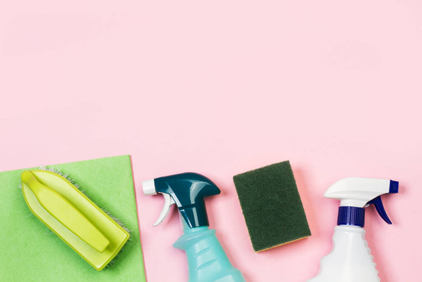 Assorted cleaning products bottles on a pink background - Photo, Image