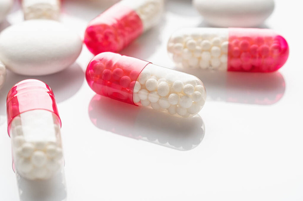 Pills on a white background. Closeup. Flu medicine. Infection treatment - Zdjęcie, obraz