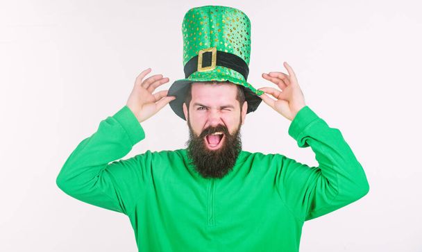 Taking raise hat in salutation. Bearded man celebrating saint patricks day. Irish man with beard wearing green. Happy saint patricks day. Hipster touching hat in leprechaun costume - Zdjęcie, obraz
