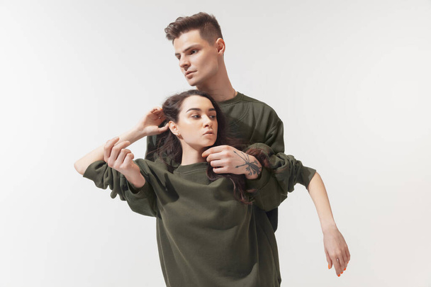 Trendy fashionable couple isolated on white studio background - Valokuva, kuva