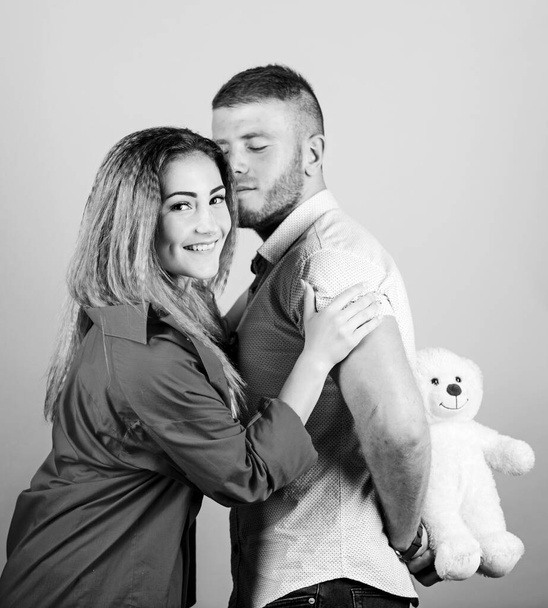 Handsome man and pretty girl in love. Man and woman couple in love. Romantic surprise. Valentines day holiday. Surprise for sweetheart. Soft toy teddy bear gift. Surprise gift concept. Surprising her - Φωτογραφία, εικόνα