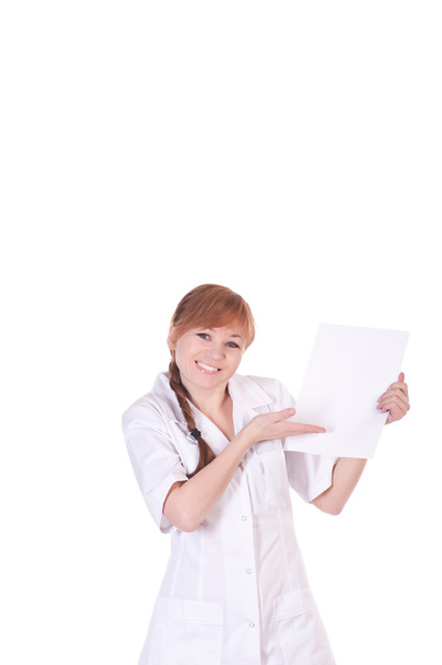Young woman doctor is holding blank paper. - Photo, Image